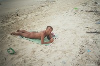 naked and happy on the sand